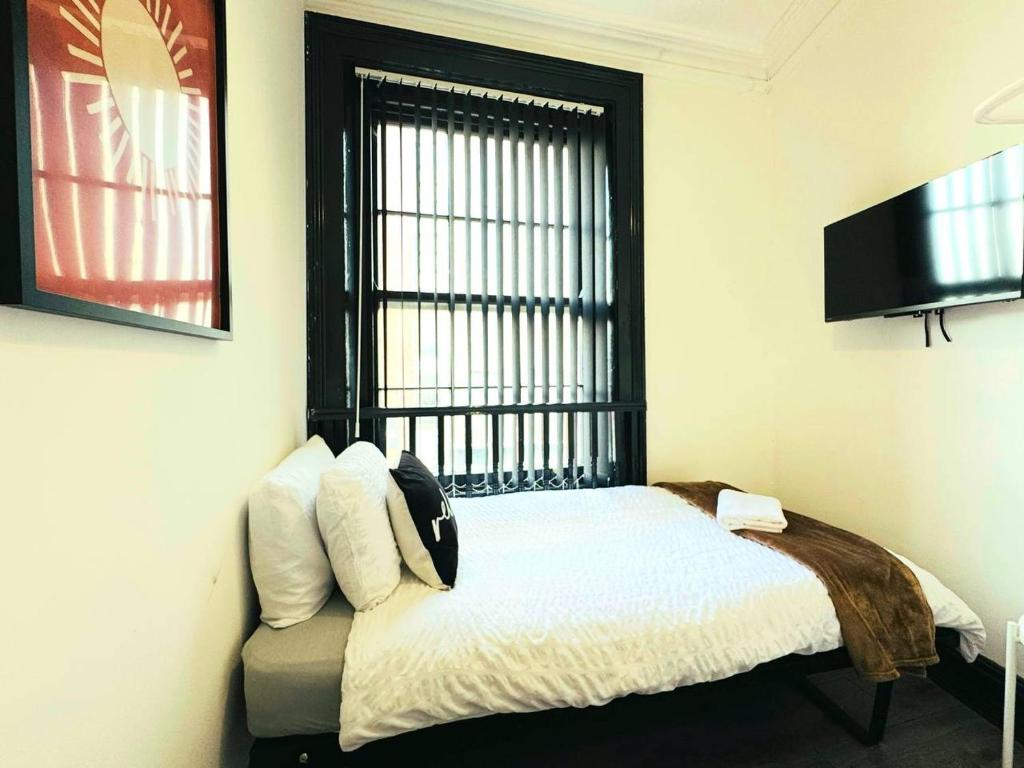 Ένα ή περισσότερα κρεβάτια σε δωμάτιο στο Pembroke Place Private Room 5B