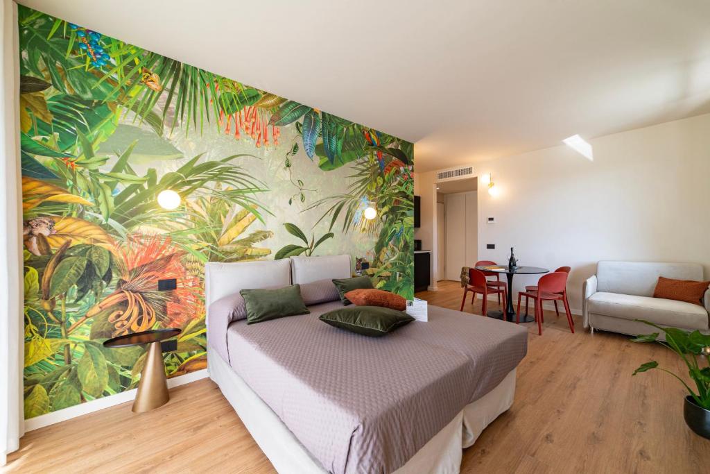 Postel nebo postele na pokoji v ubytování Urban Lodge- Appartamenti in Franciacorta