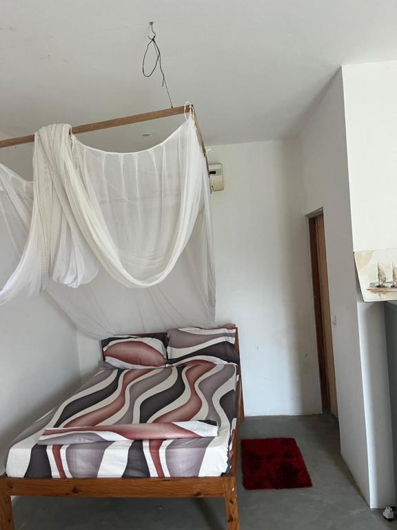 Ένα ή περισσότερα κρεβάτια σε δωμάτιο στο Kategha Beach Guesthouse
