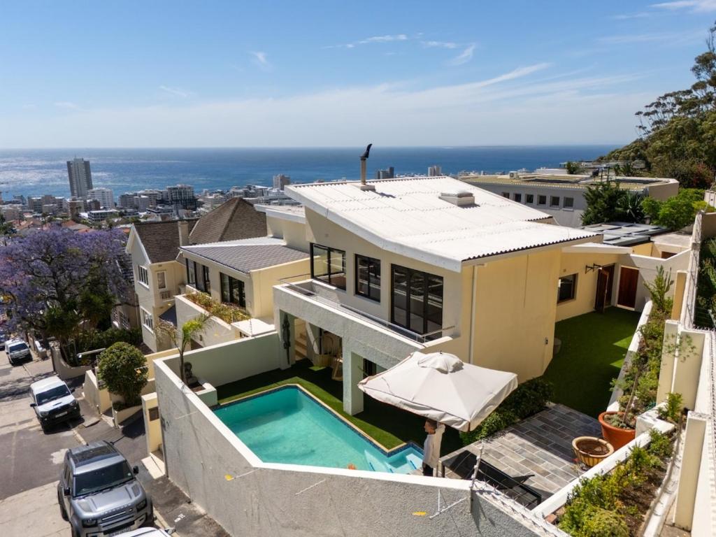an aerial view of a house with a swimming pool at Sun & Fun In Fresnaye - Family Summer in Cape Town