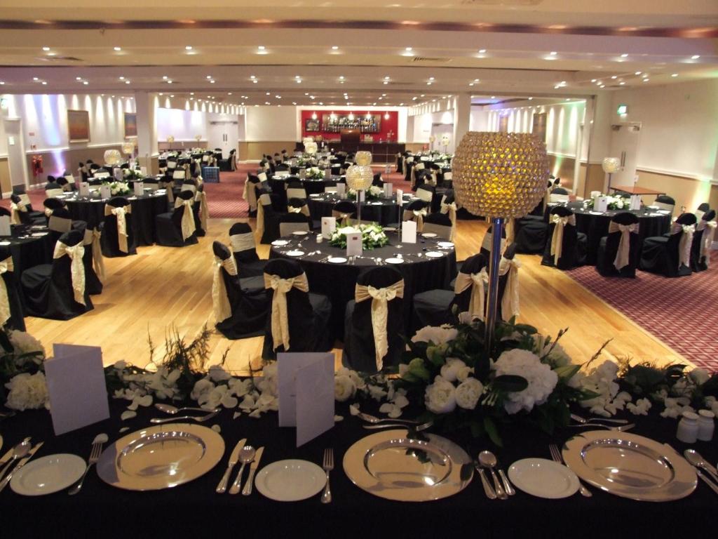a banquet hall with tables set up for a wedding at Ashbourne House Hotel in Ashbourne