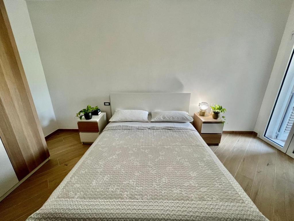 Ένα ή περισσότερα κρεβάτια σε δωμάτιο στο Casa di Tinny