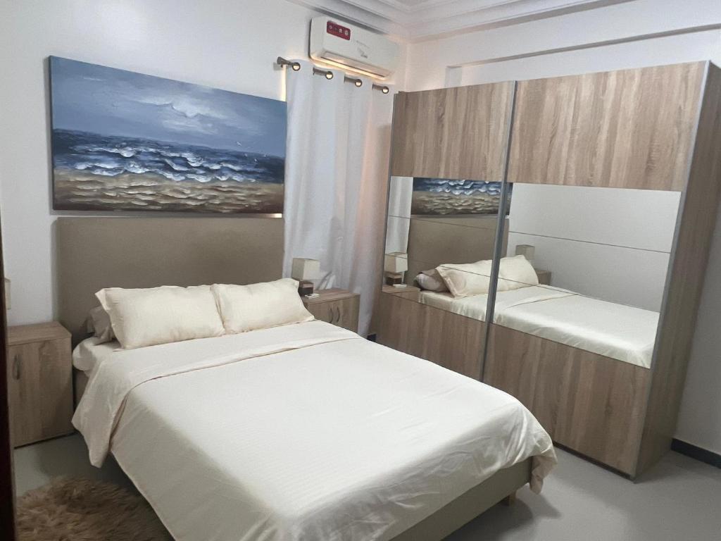 Postel nebo postele na pokoji v ubytování Farid Street - Studio - Dakar Plateau