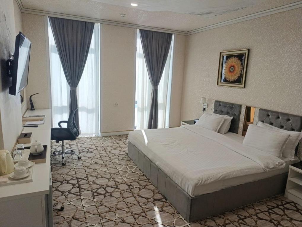 Postel nebo postele na pokoji v ubytování The Tower Bukhara