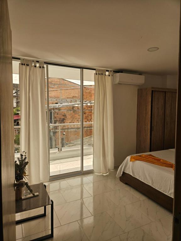 Postel nebo postele na pokoji v ubytování Nº 302 Aparta vacacional Doradal