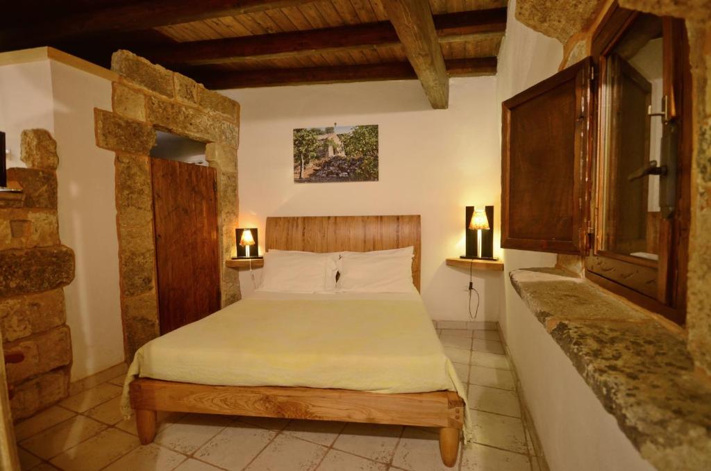 Postel nebo postele na pokoji v ubytování Felline In Bed&Breakfast Dimora di Charme el Salento