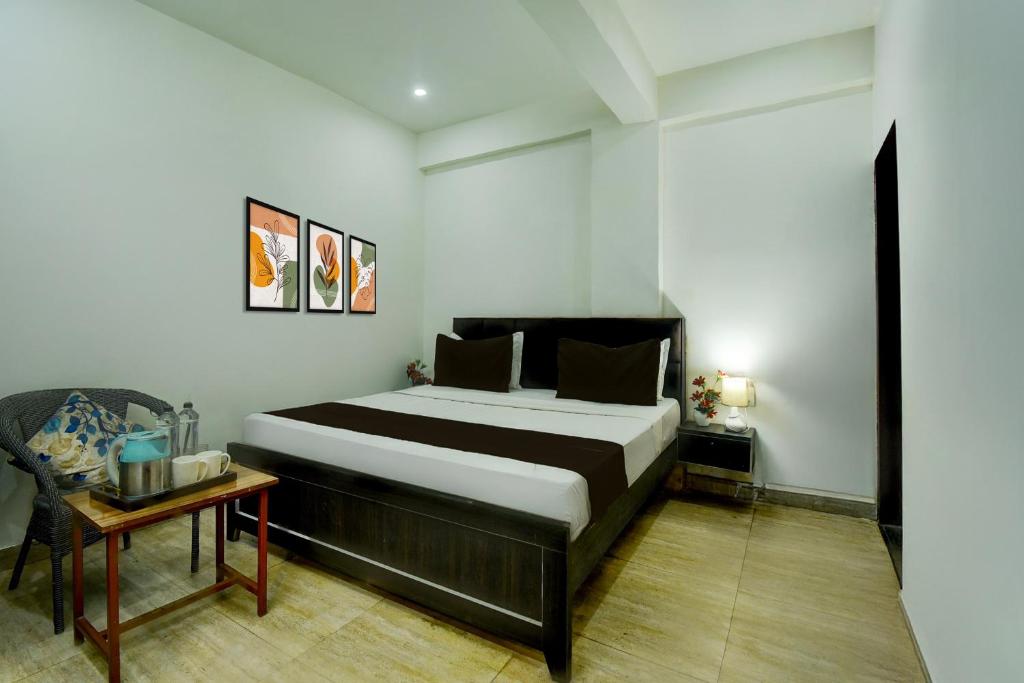 Ένα ή περισσότερα κρεβάτια σε δωμάτιο στο Hotel O H Pass