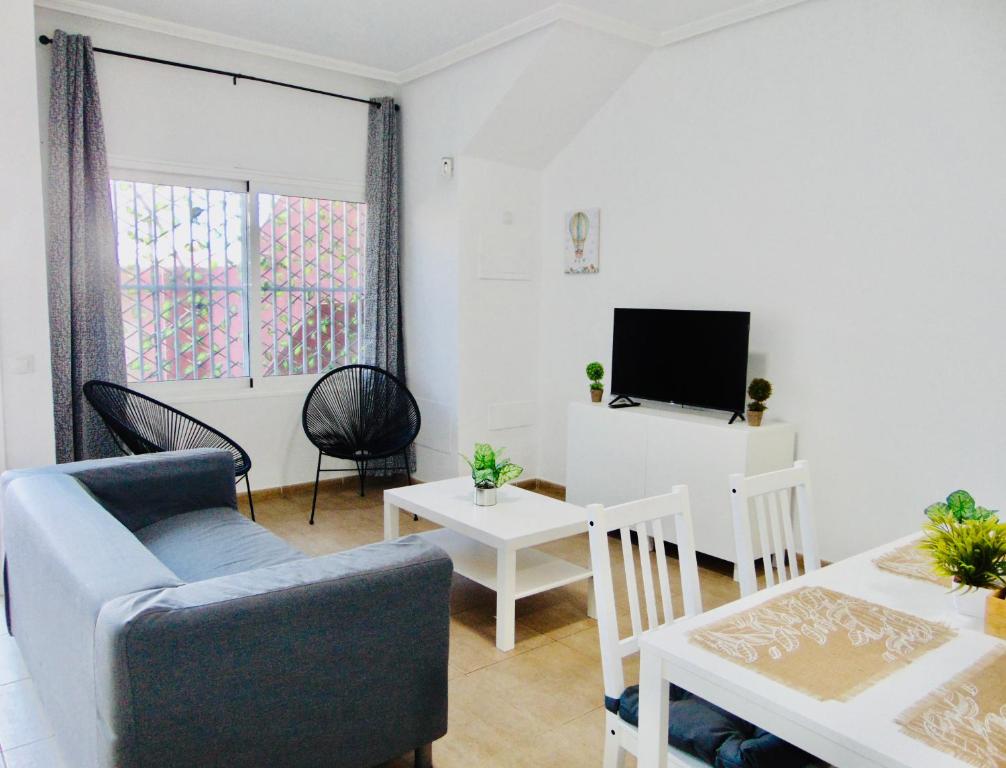 Una televisión o centro de entretenimiento en Cuscio House Fuerteventura