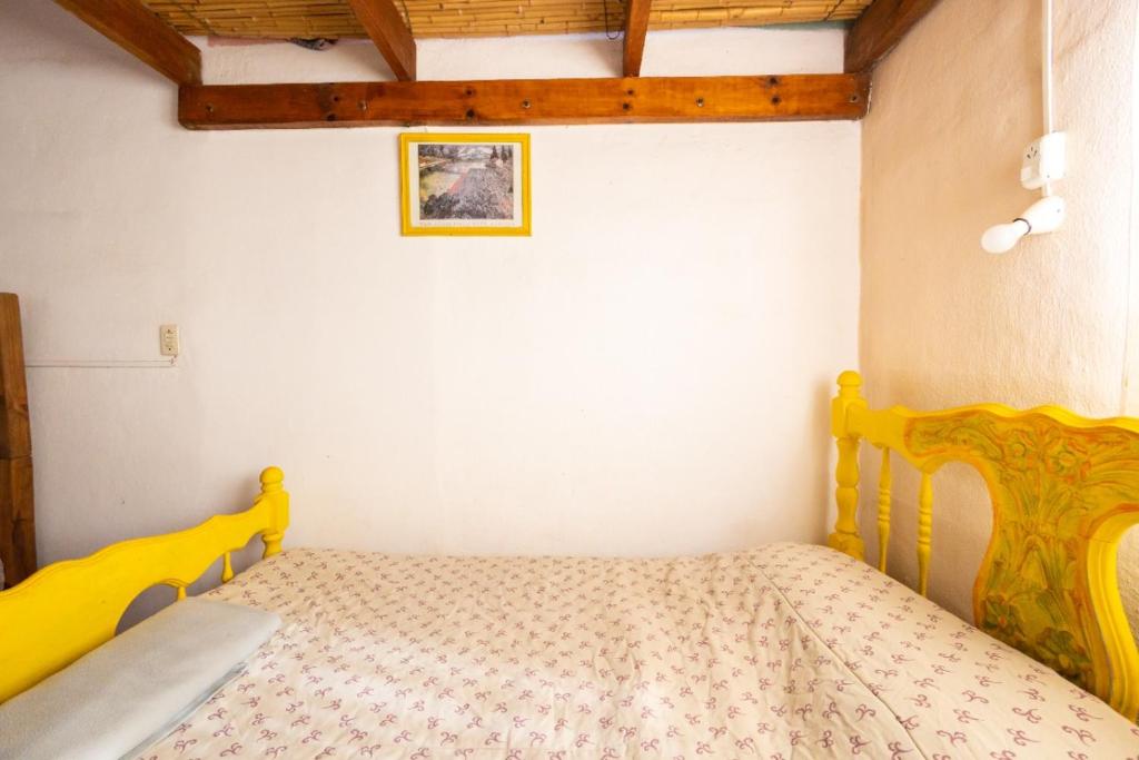 Ένα ή περισσότερα κρεβάτια σε δωμάτιο στο Cabañas rainbow