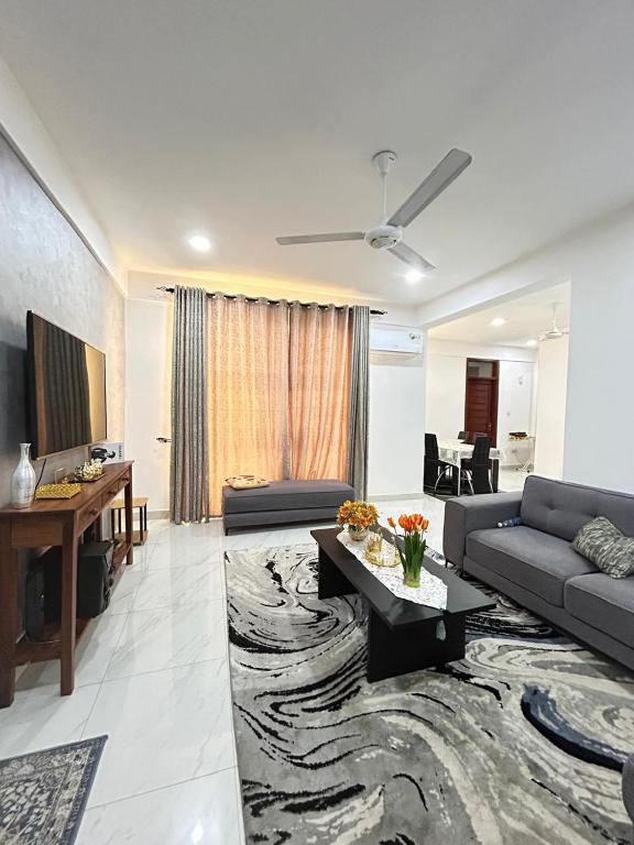 a living room with a couch and a table at Zanzibar Cozy Home in Zanzibar City