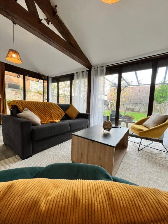 Posezení v ubytování Au petit Jardin Sézannais