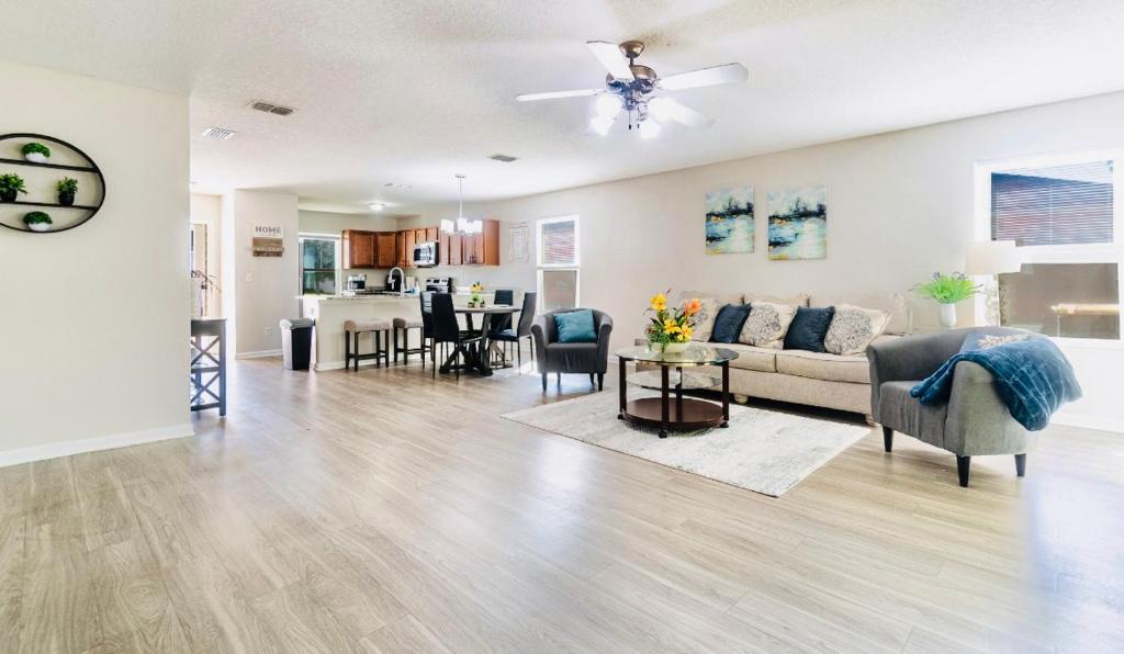 a living room with a couch and a table at Cozy 4 BR Abode in Jacksonville