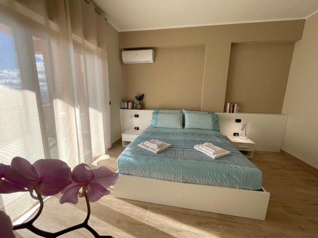 Postel nebo postele na pokoji v ubytování Casa Viale Kennedy