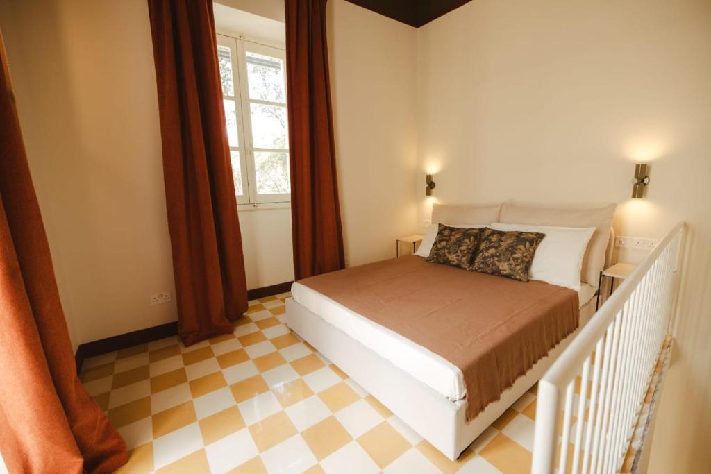 En eller flere senge i et værelse på Traditional Maltese home in the three cities - 500m away from Valletta Ferry