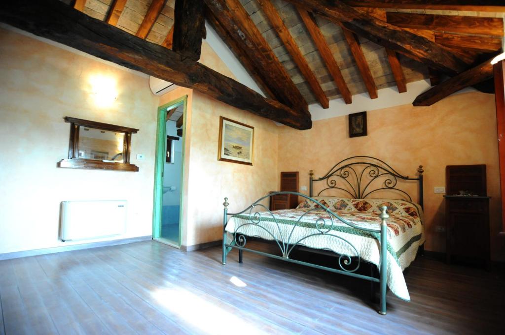 Säng eller sängar i ett rum på Corte Pioppazza
