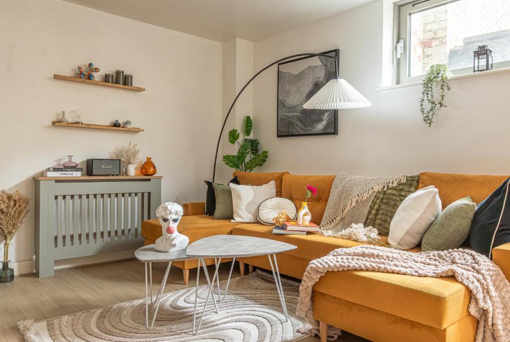 a living room with a couch and a table at The Viva Apartments Luxe in Birmingham
