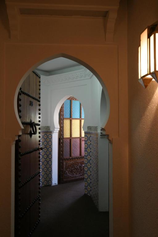 Vuode tai vuoteita majoituspaikassa Hotel Chellah