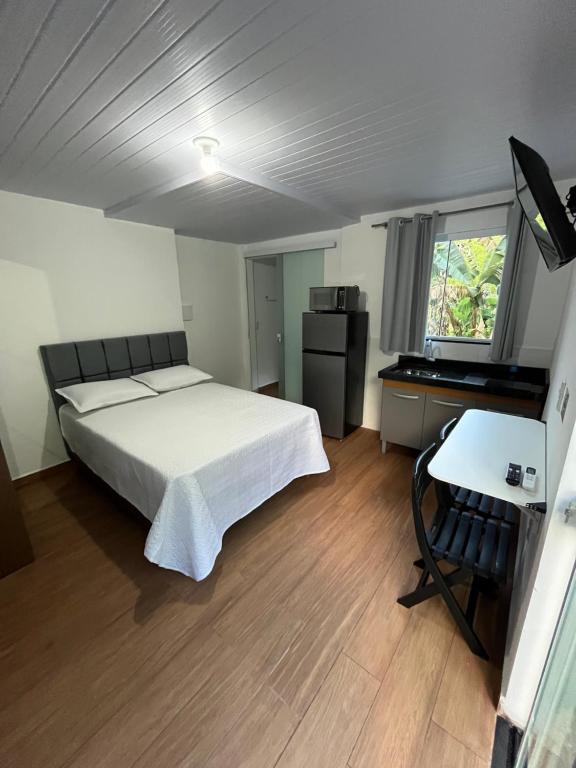 Ένα ή περισσότερα κρεβάτια σε δωμάτιο στο Flat privativo Residencial Schlichting