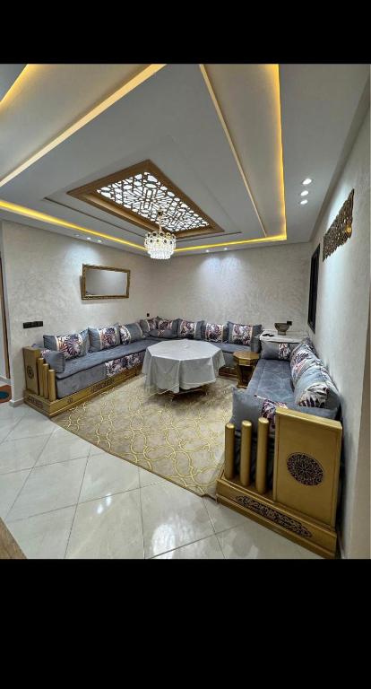 a living room with a couch and a table at Residence Ritaj in Agadir