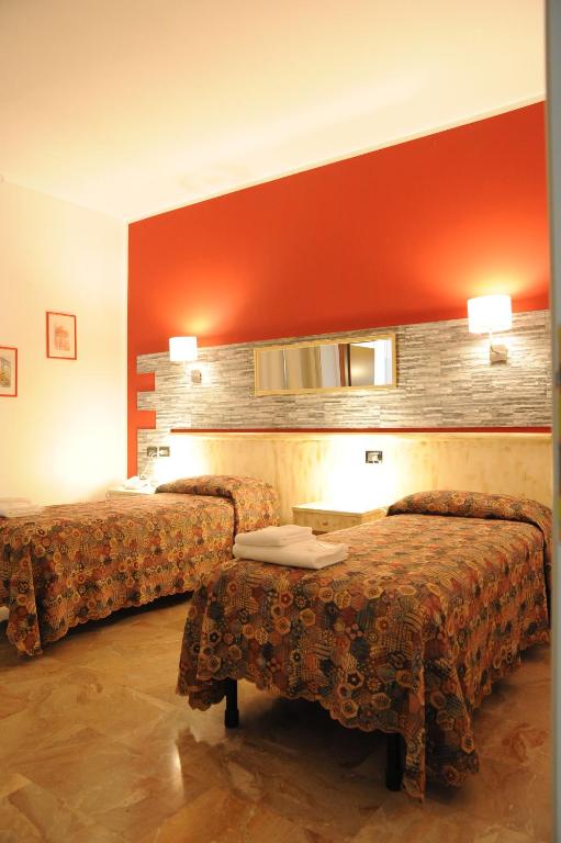 Postel nebo postele na pokoji v ubytování Hotel del Ponte