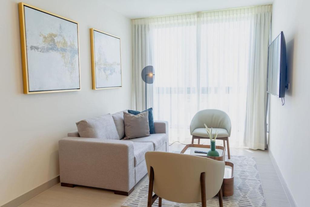 a living room with a couch and a chair at Arcadia - Fully Furnished 2 Bedroom Apartment - 2705 in Panama City