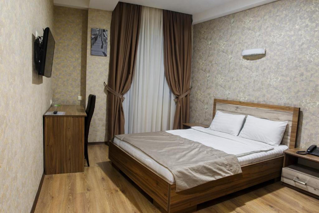 Postel nebo postele na pokoji v ubytování Hotel Gureli