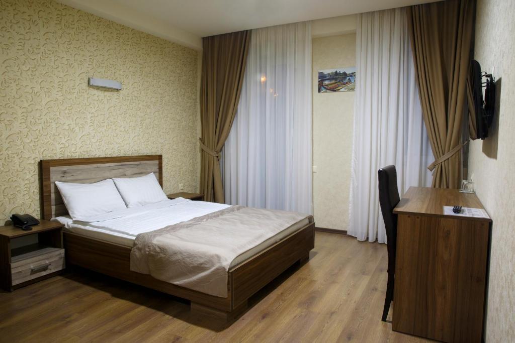 Postel nebo postele na pokoji v ubytování Hotel Gureli