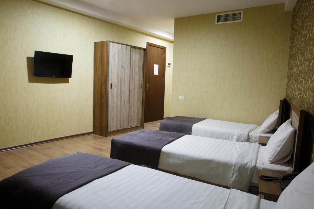 Postel nebo postele na pokoji v ubytování Hotel Gureli