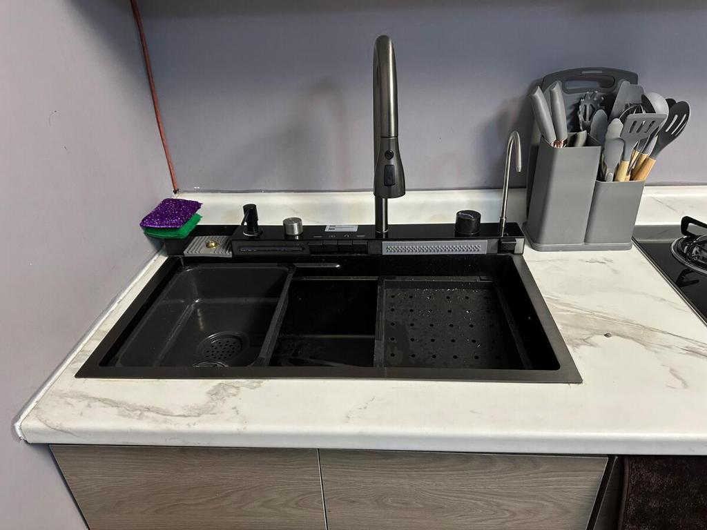 Kuchyň nebo kuchyňský kout v ubytování Depa nuevo y equipado en Saltillo 2 recámaras