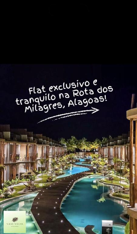 a picture of a swimming pool at a resort at Naay Villas - Flat Beira Mar - Sao Miguel dos Milagres in Pôrto de Pedras