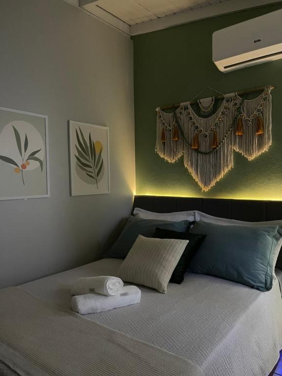 Ένα ή περισσότερα κρεβάτια σε δωμάτιο στο Ótima suíte privada em Torres