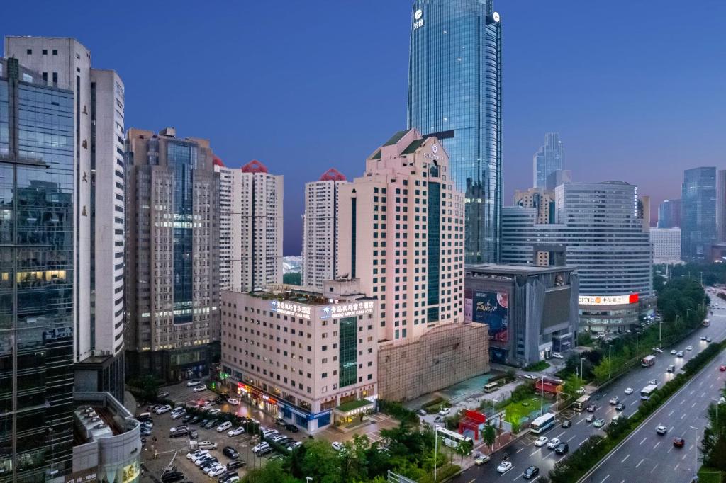 an aerial view of a city with many tall buildings at 青岛机场富华酒店 in Qingdao