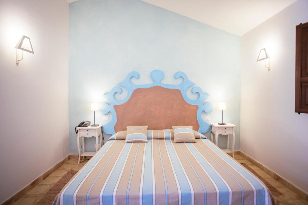 Postel nebo postele na pokoji v ubytování Hotel Baglio Catalano