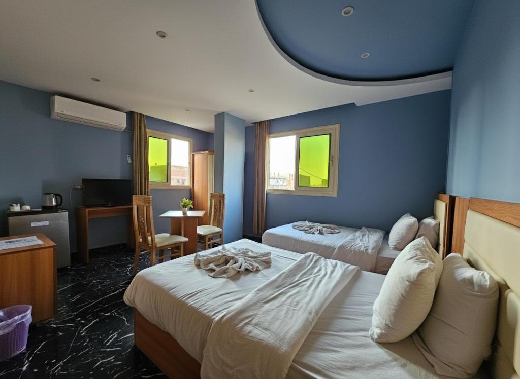 Ένα ή περισσότερα κρεβάτια σε δωμάτιο στο The Fourth pyramid