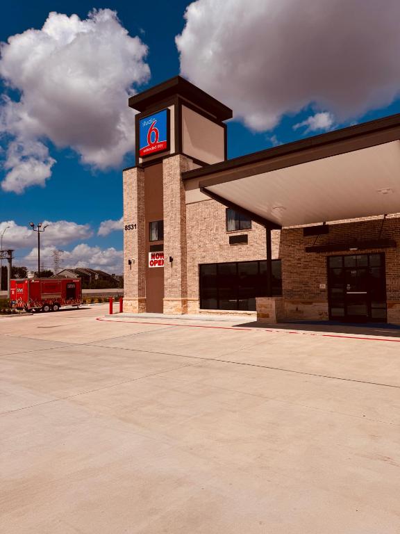 a gas station with a sign on top of it at Studio 6 Humble, TX in Humble