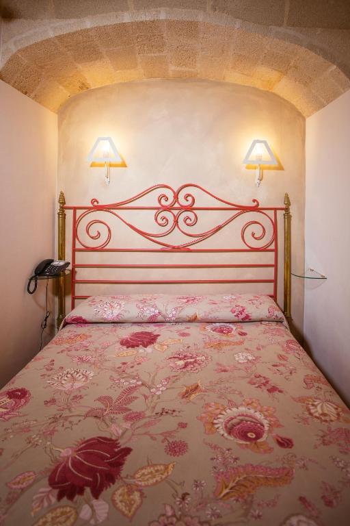 Postel nebo postele na pokoji v ubytování Hotel Baglio Catalano