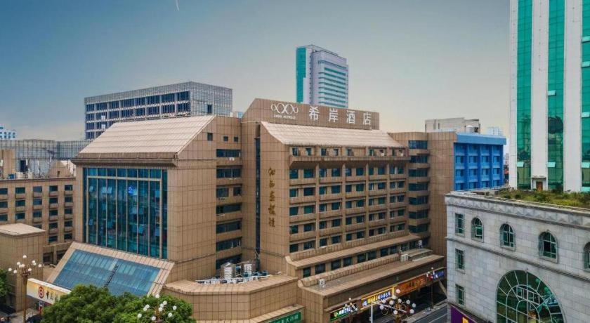 a group of tall buildings in a city at Xana Hotelle·Nanchang Bayi Square Metro Station in Nanchang