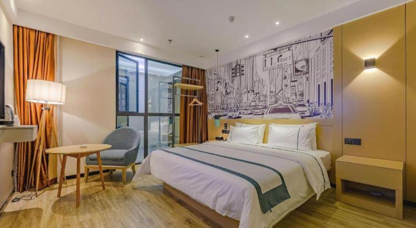 Postel nebo postele na pokoji v ubytování City Comfort Inn Chengdu Wenjiang Zhujiang Square Guanghua Park Metro Station