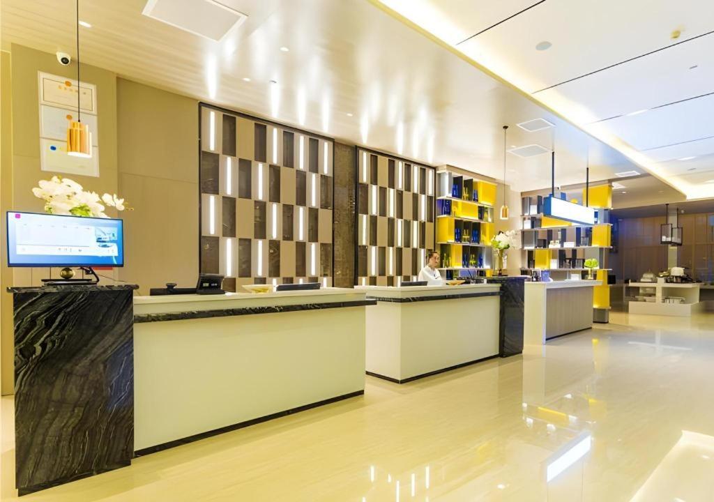 TV a/nebo společenská místnost v ubytování Echarm Hotel Qujing High-speed Railway Station 1st Wuguan Center