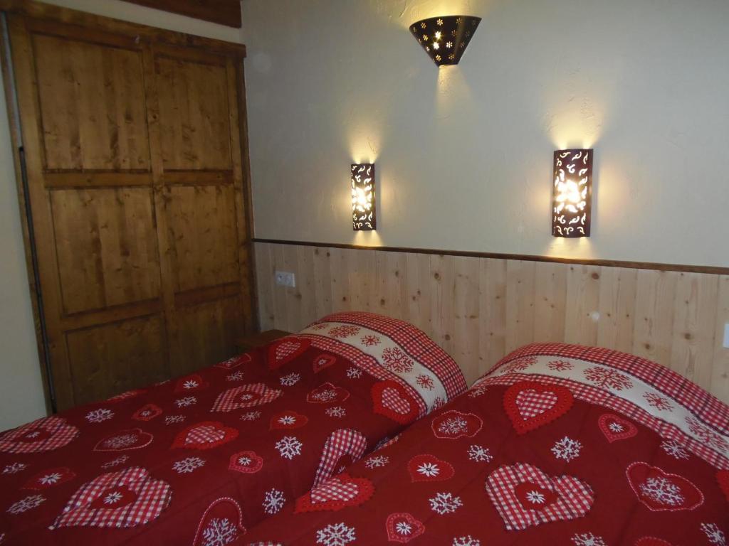 Voodi või voodid majutusasutuse Chalet l'aubépine résidence B&B toas