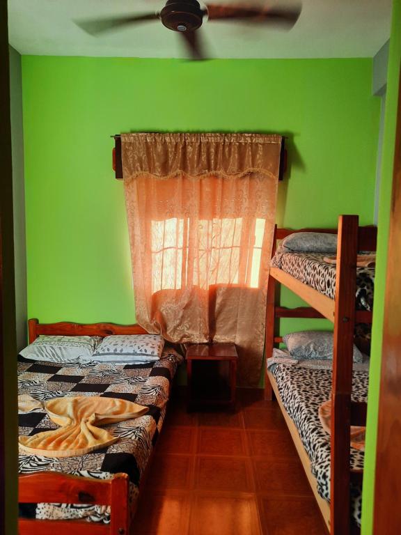 Postel nebo postele na pokoji v ubytování Residencial Mc