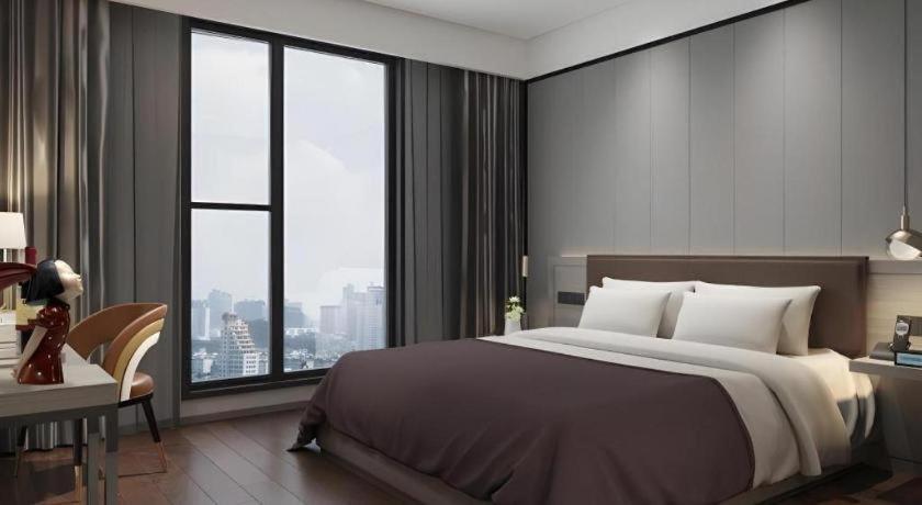 Postel nebo postele na pokoji v ubytování GYA Hotel Taiyuan Zonggai Zone Ancient County Chengnan Station