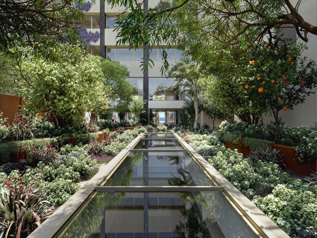 a garden in the middle of a building at Hilton Chania Old Town Resort & Spa in Chania