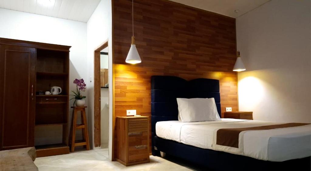 Ένα ή περισσότερα κρεβάτια σε δωμάτιο στο MenTari GuestHouse