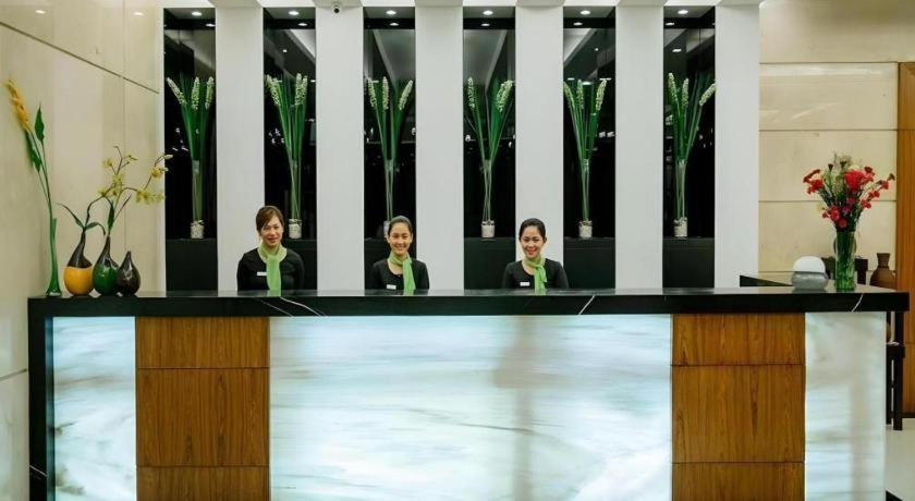 two women sitting at a counter in a room at Oryza Hotel in Santiago City