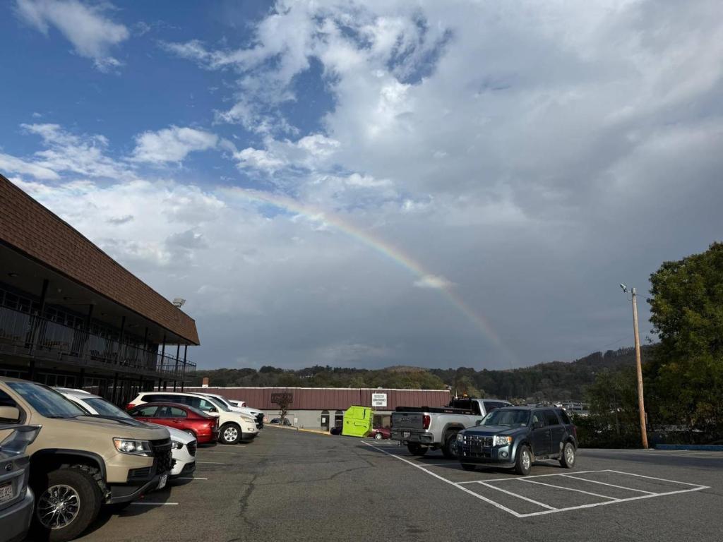 a rainbow in the sky over a parking lot at Econo Lodge Galax in Galax