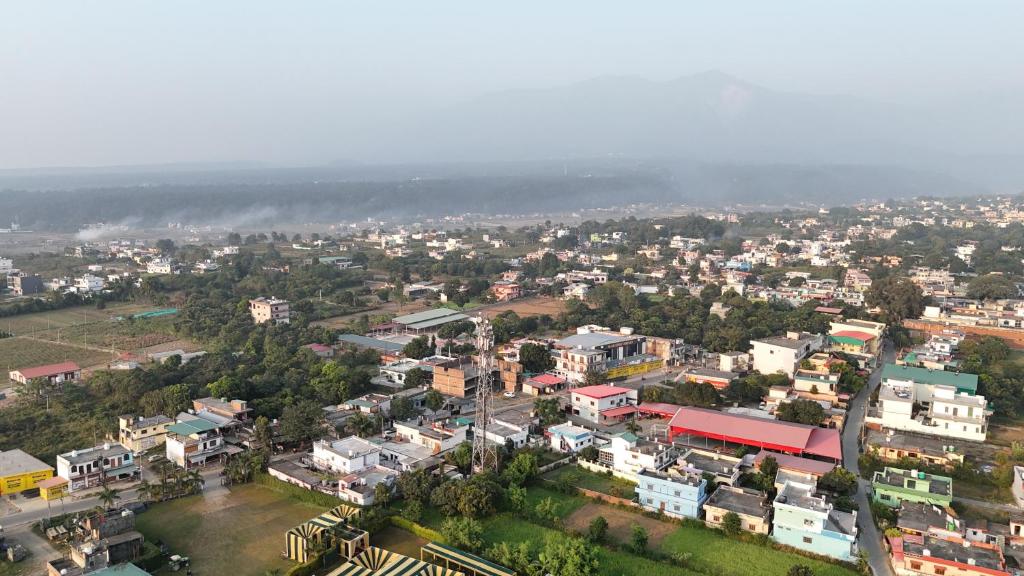 an aerial view of a city with buildings at Panwar peaceful homestay in Jhājra