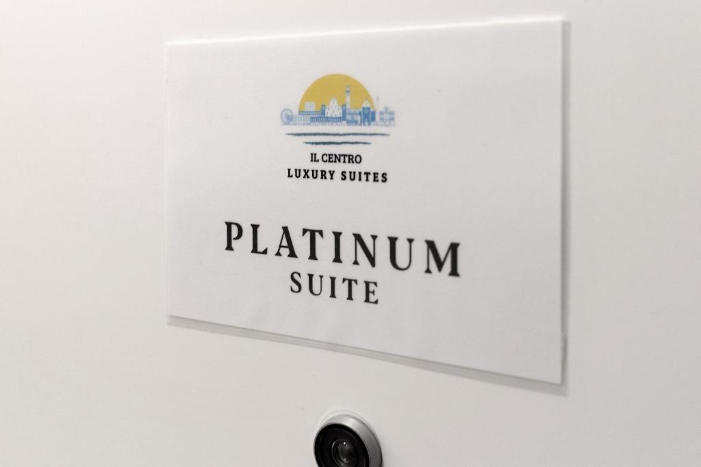 a sign on a wall with the platinnum suite at Platinum - Il Centro Luxury Suites in Bari
