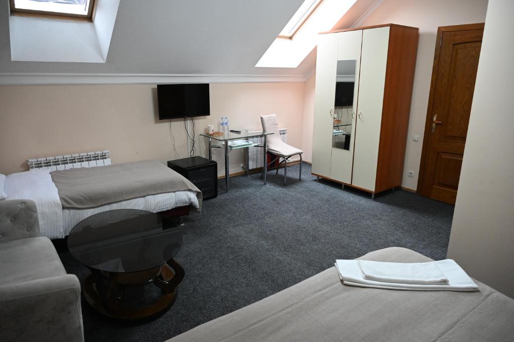 TV a/nebo společenská místnost v ubytování NoirHotel