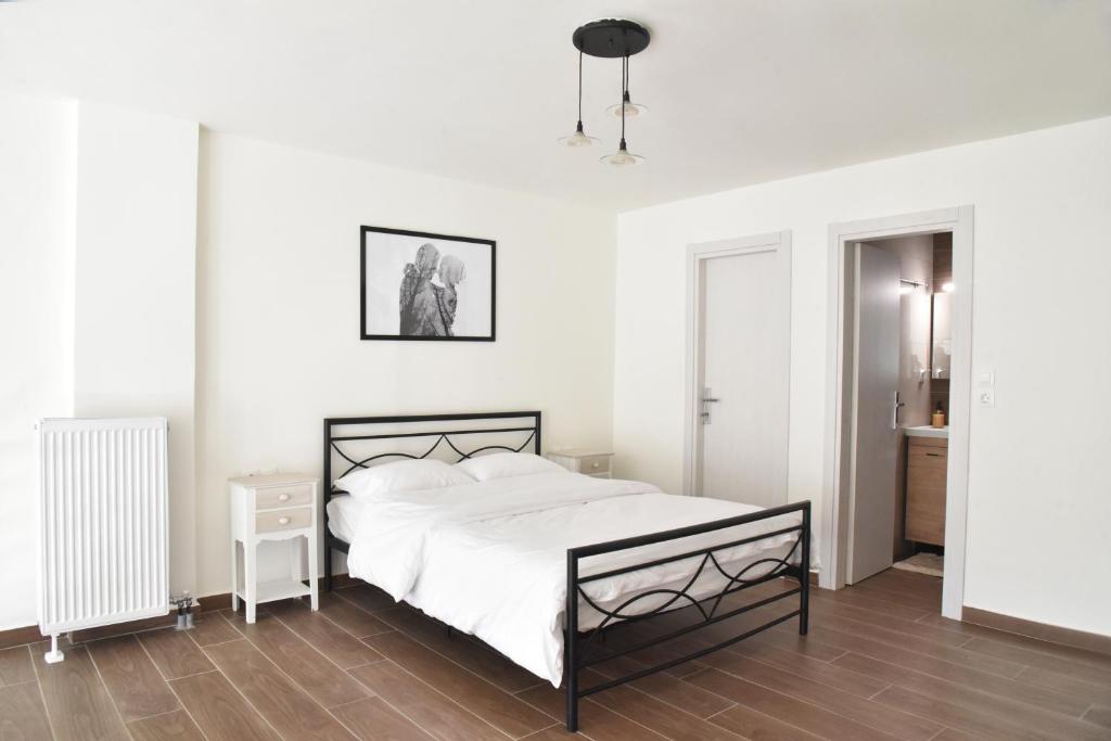 Un pat sau paturi într-o cameră la Annabell Houses & Rooms